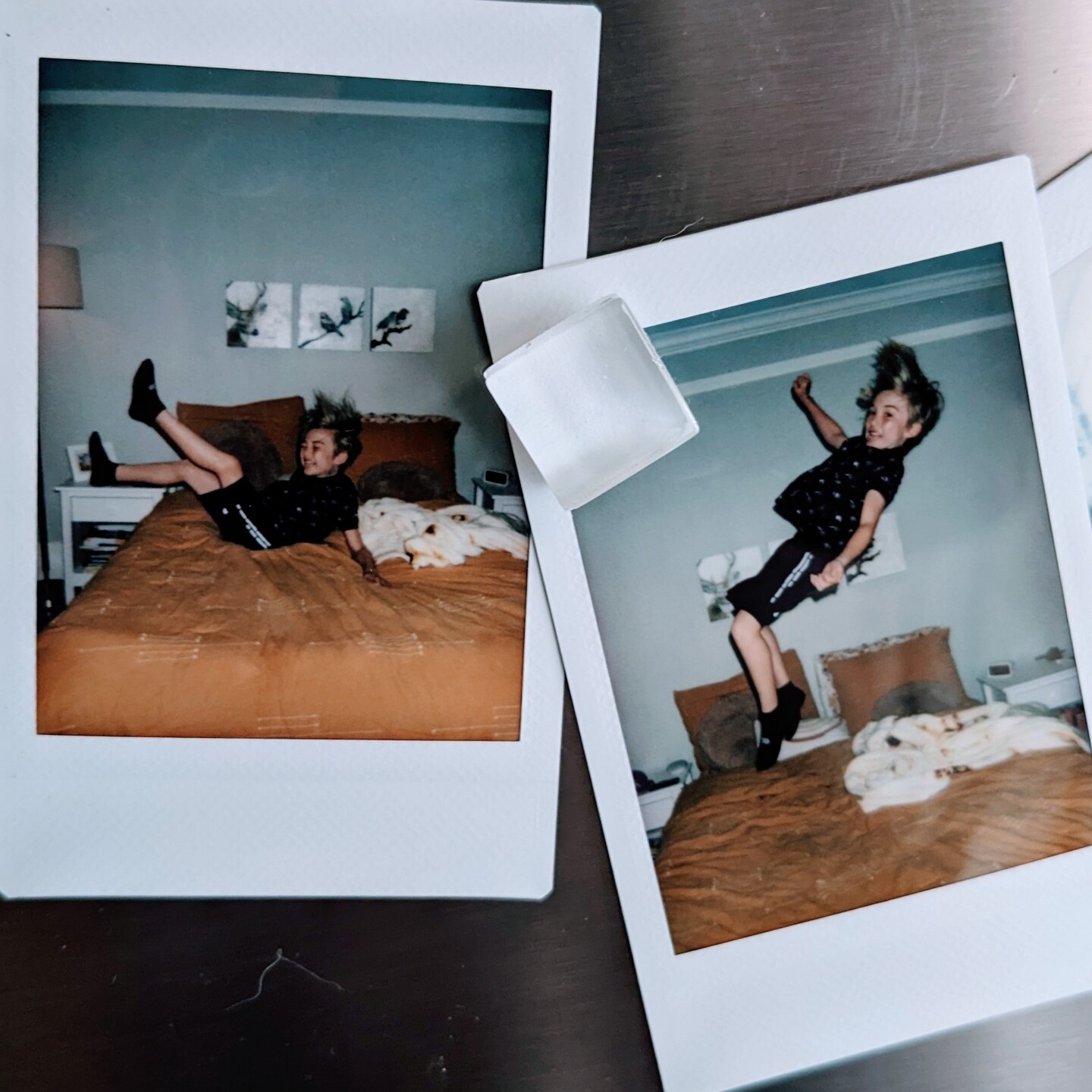 A photo of Polaroid photos of a boy bouncing on a bed